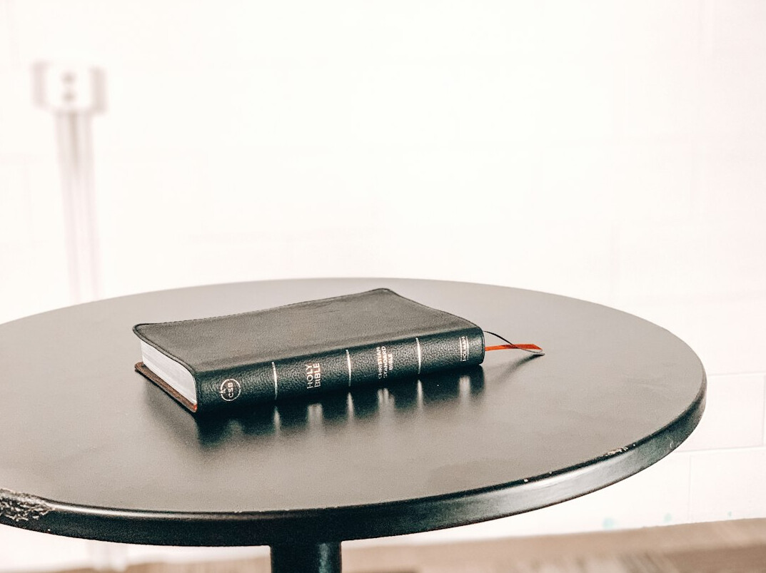 Two cups of coffee and a notebook on a consultation table