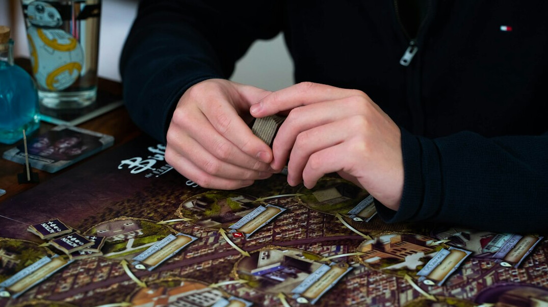 person counting coins at table