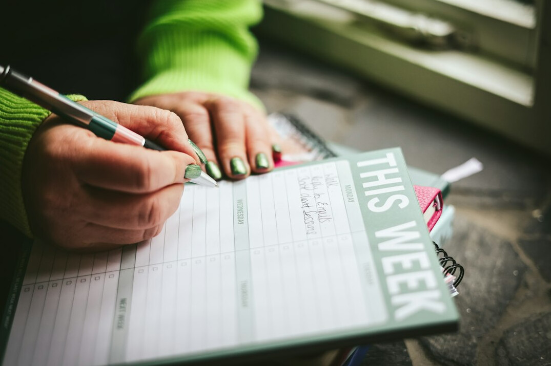 person planning weekly budget