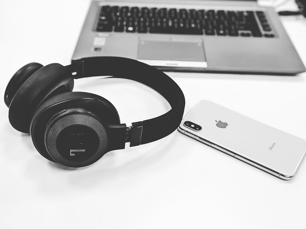 Headset and laptop prepared for an online consultation