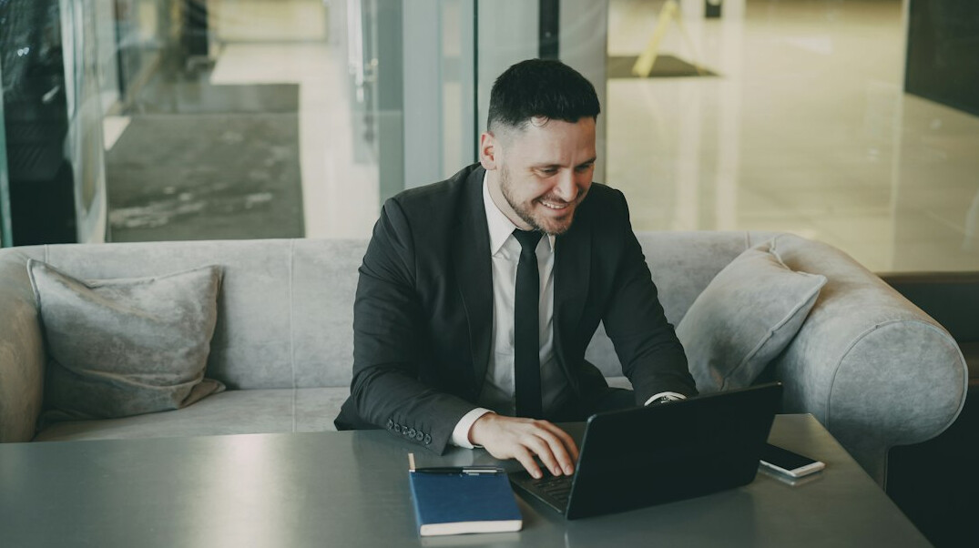 busy professional checking budget on laptop